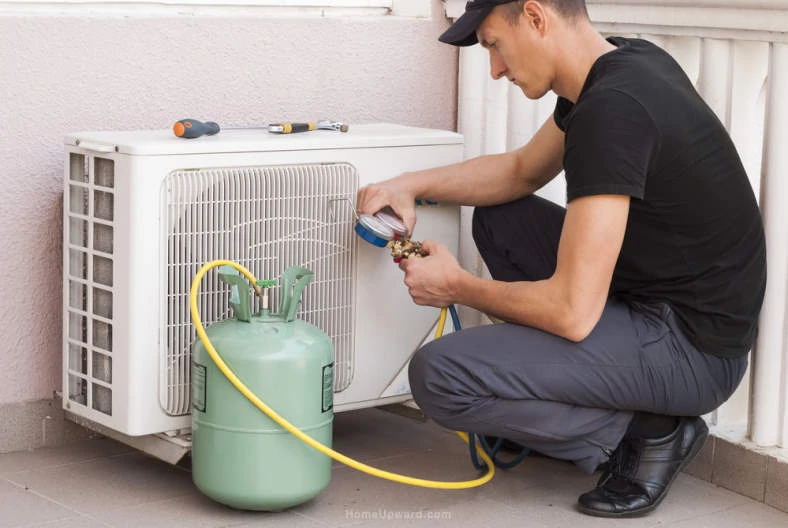 Example image of an HVAC technician adding freon to air conditioner