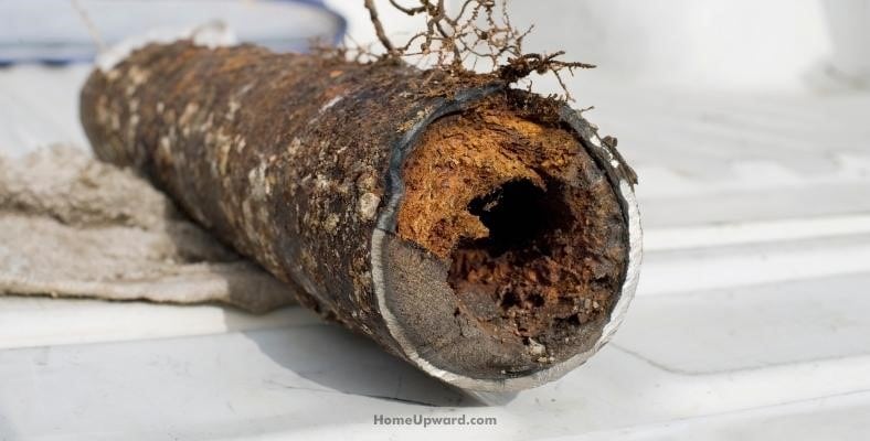 what causes rust in pipes or a toilet